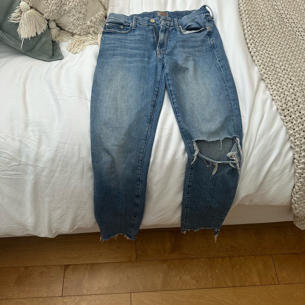 Mother raw hem crop Jean with destroyed knee.